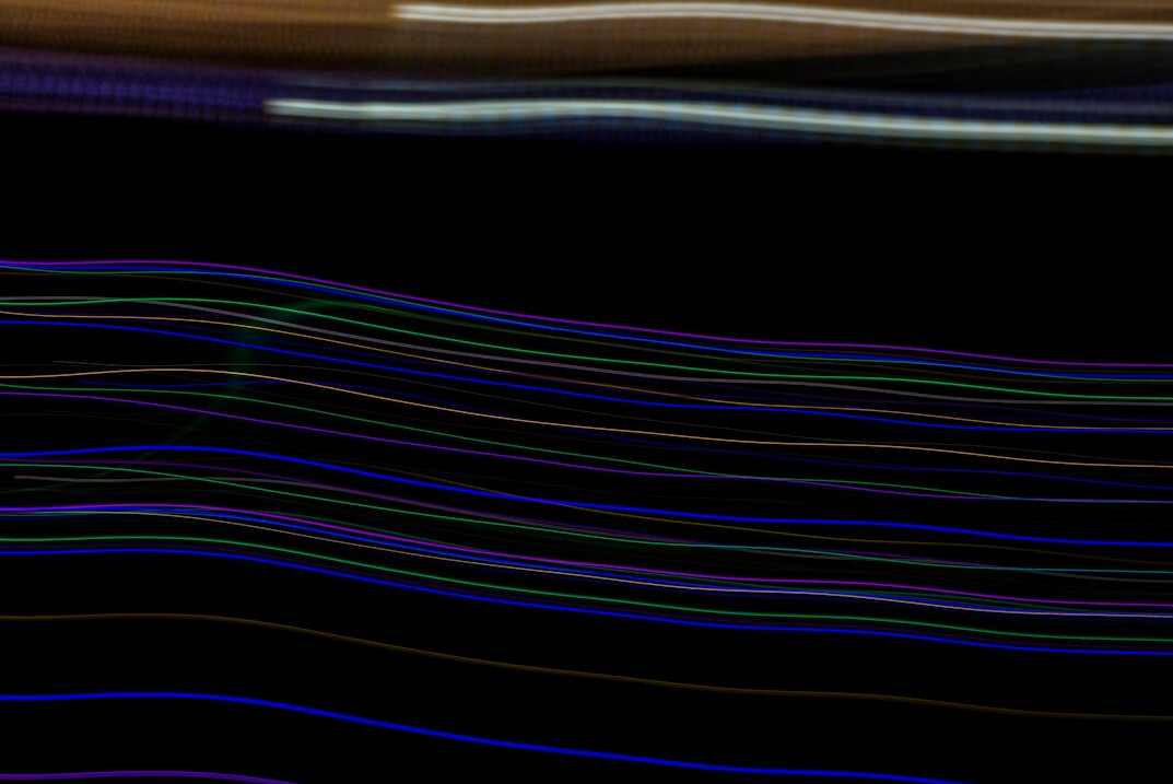 Close up of a computer screen showing colorful lines of source code