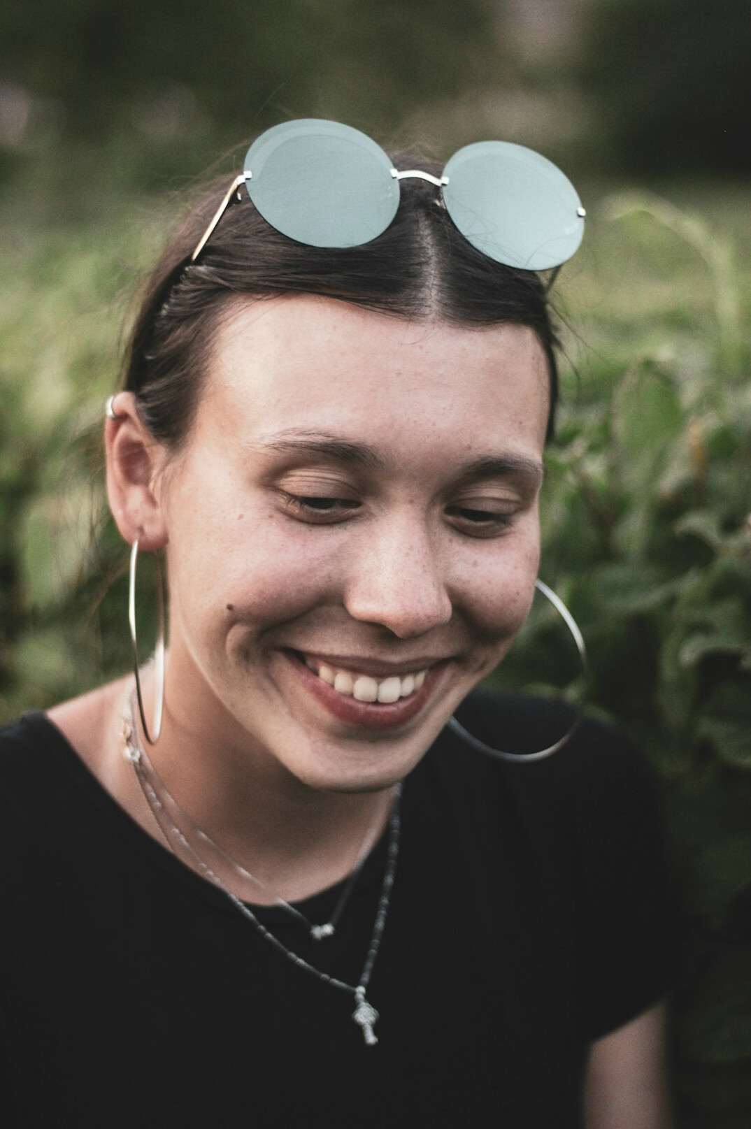Portrait of a smiling woman with glasses in an office setting