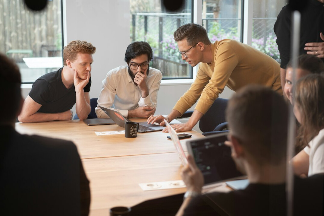 corporate team discussing programming