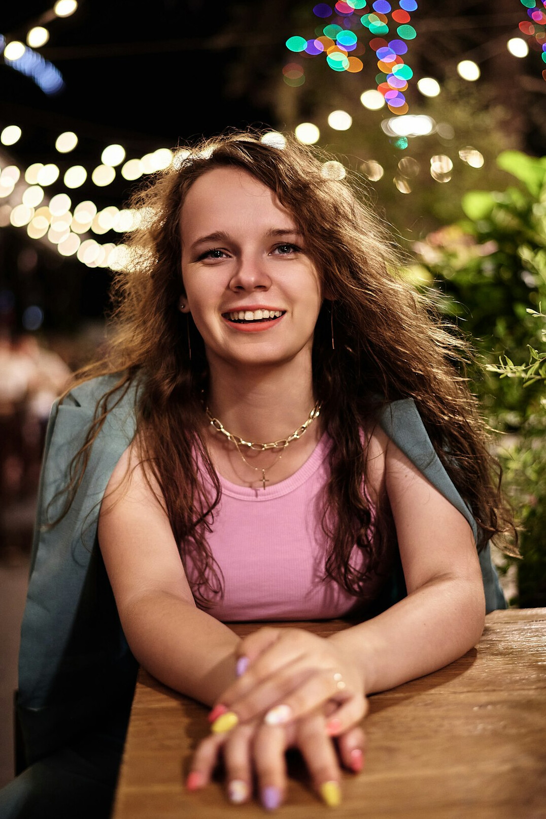 Portrait of a smiling young woman with curly hair