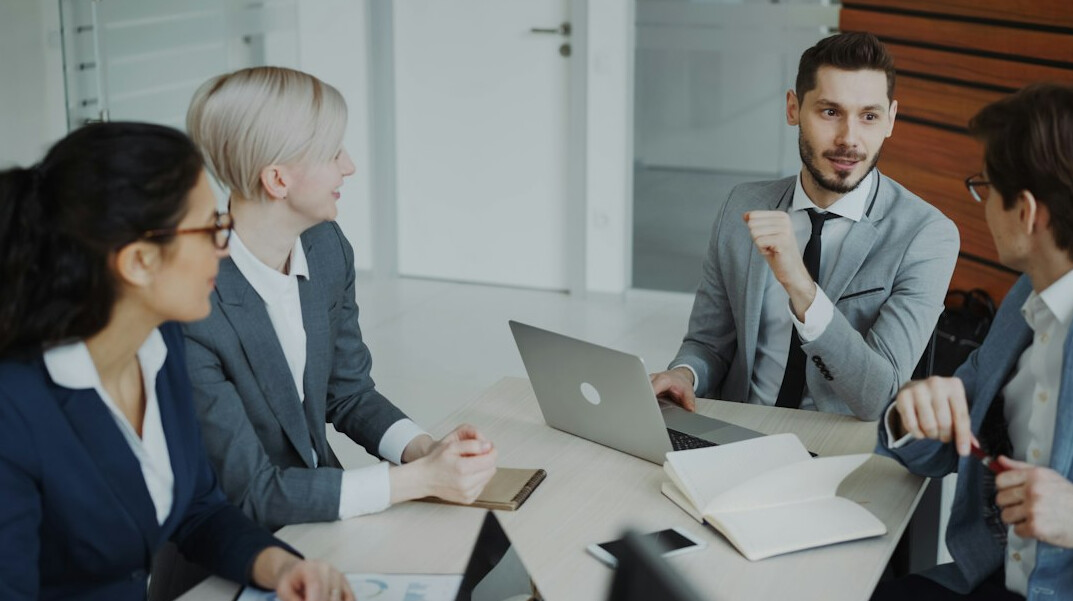 corporate team discussing software